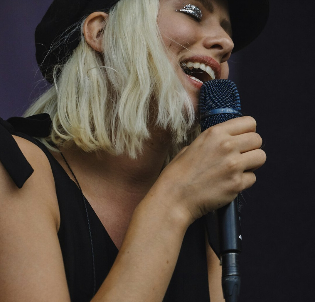 woman singing on stage