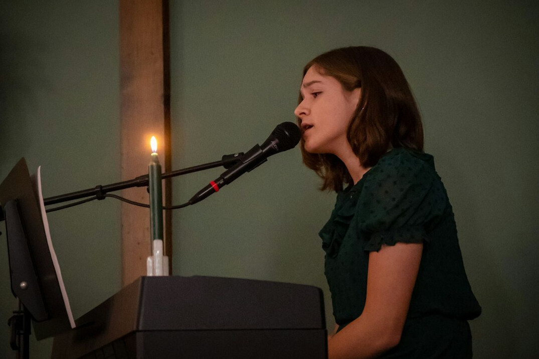 woman singing on stage